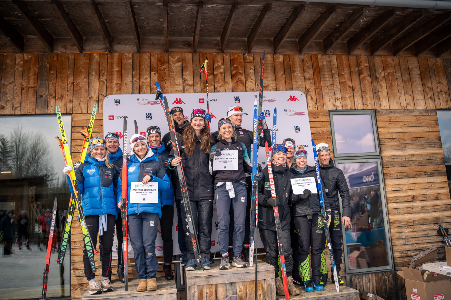The 2026 SuperTour Finals relay podium with Team Birkie, APU, and Craftsbury at Craftsbury, Vermont